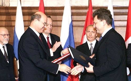 Signing Russian-Canadian documents.