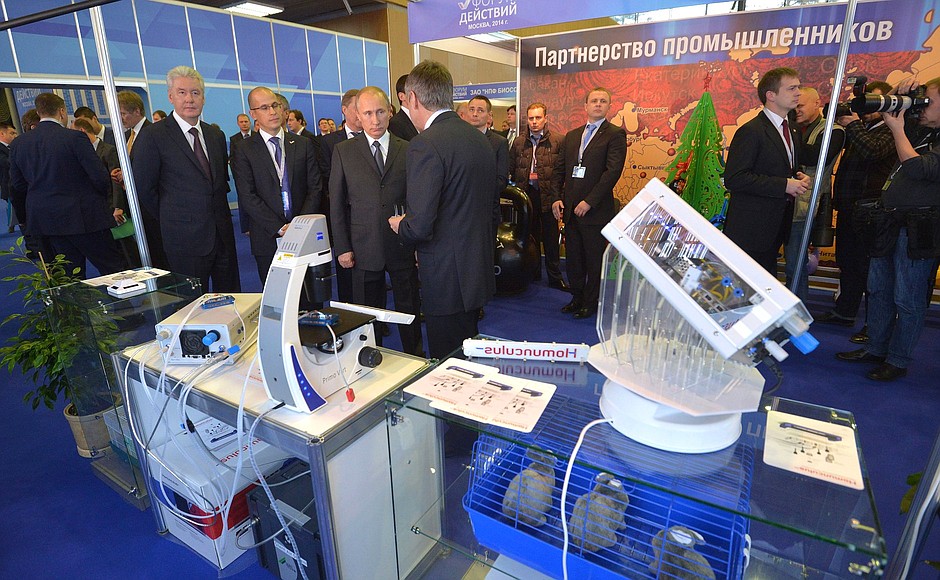 Vladimir Putin visits the Made in Russia exhibition that showcases the latest developments in medicine, laboratory diagnostics, sports and car manufacturing.