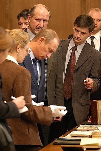 President Putin examining rare books.