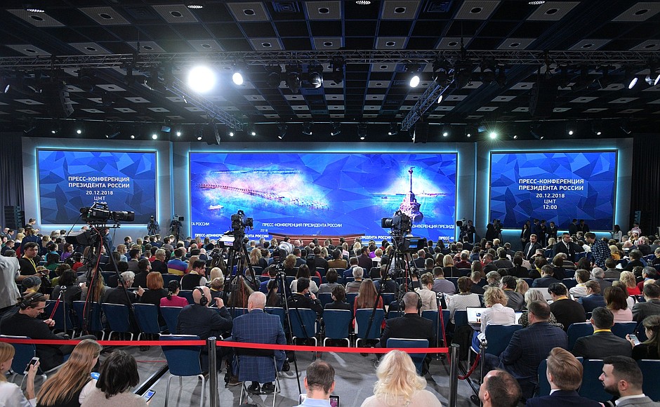 Before the beginning of Vladimir Putin’s annual news conference.