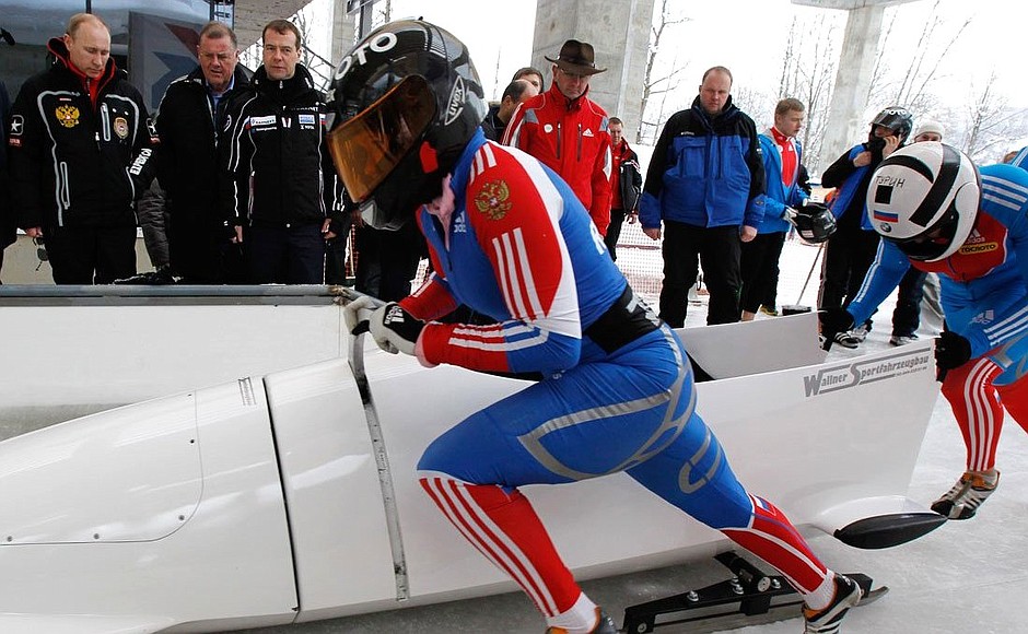 With Prime Minister Vladimir Putin during test runs on the sledding and bobsleigh track.