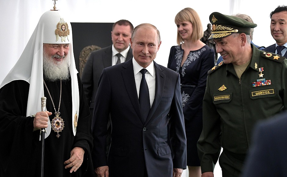 With Patriarch Kirill of Moscow and All Russia and Defence Minister Sergei Shoigu after the consecration ceremony for the stepping stone of the main church of the Armed Forces at Patriot military-patriotic park.