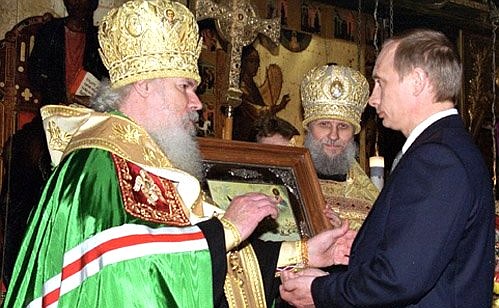 A ceremonial prayer on the inauguration of the new President. Alexy II, Patriarch of Moscow and All Russia, presents the icon of St Alexander Nevsky to Mr Putin.