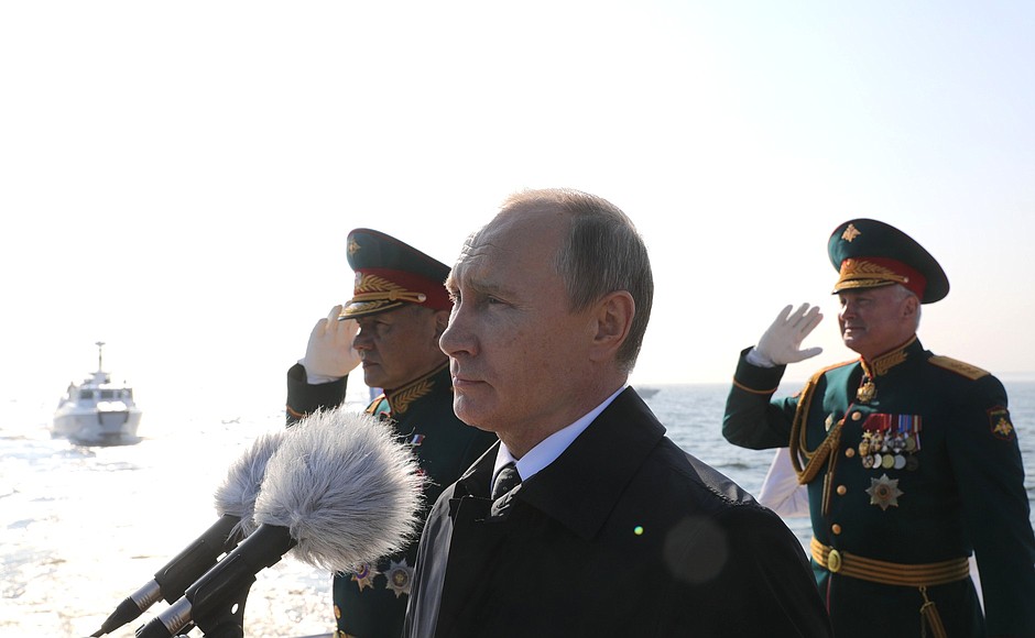 Before the main part of the Main Naval Parade, Vladimir Putin sailed round the combat ships lined up for the parade in the inner harbour of Kronstadt, and welcomed their crews.