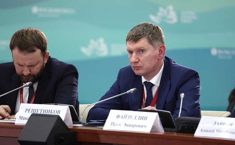 Aide to the President Maxim Oreshkin, left, and Minister of Economic Development Maxim Reshetnikov during the meeting of State Council Presidium on Tourism Development.