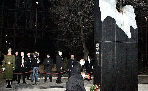 Laying flowers on the monument to the victims of events in 1956, the eternal flame of the revolution.