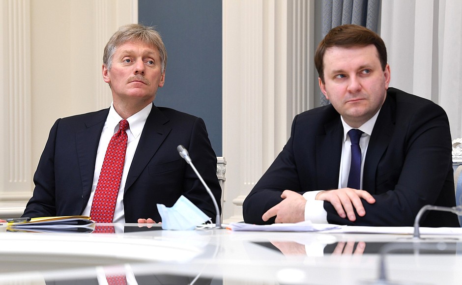 Deputy Chief of Staff of the Presidential Executive Office – Presidential Press Secretary Dmitry Peskov, left, and Aide to the President Maxim Oreshkin at a meeting on economic issues via videoconference.