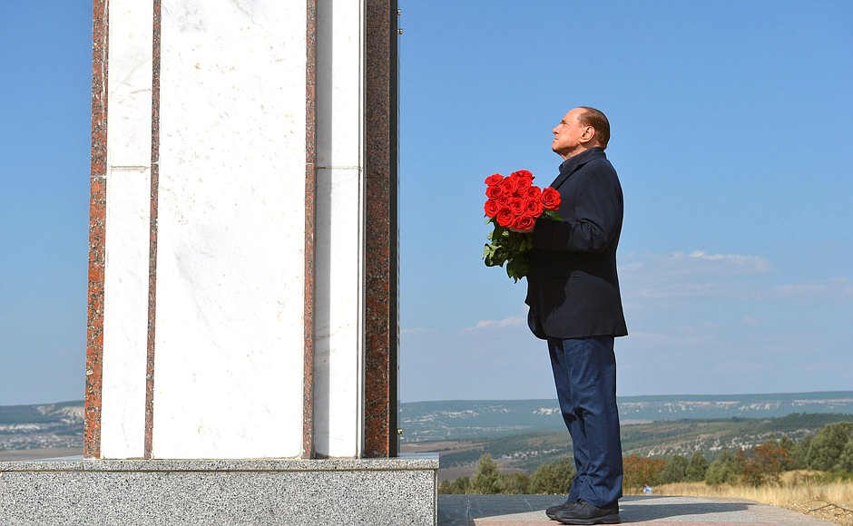 Silvio Berlusconi honours the memory of Sardinian soldiers killed during the Crimean War by laying flowers at the memorial at the foot of the mountain Gasfort.
