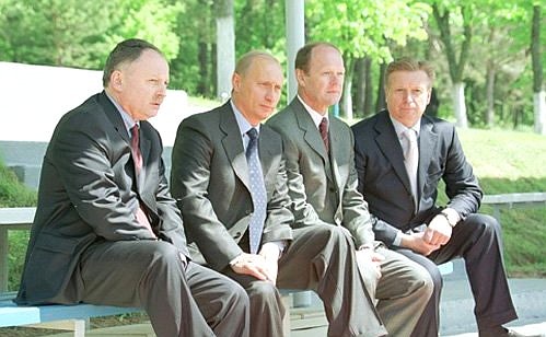 President Putin with head of the Russian Olympic Committee Leonid Tyagachev, director of the Russian Football Union Alexander Tukmanov, director-general of the Bor Recreation Centre Alexander Balashov (right to left) watching a workout at the Russian football team\'s training camp.