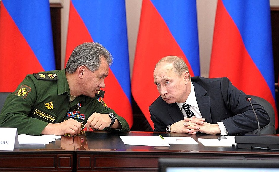 With Defence Minister Sergei Shoigu at a meeting on developing the higher military education system.