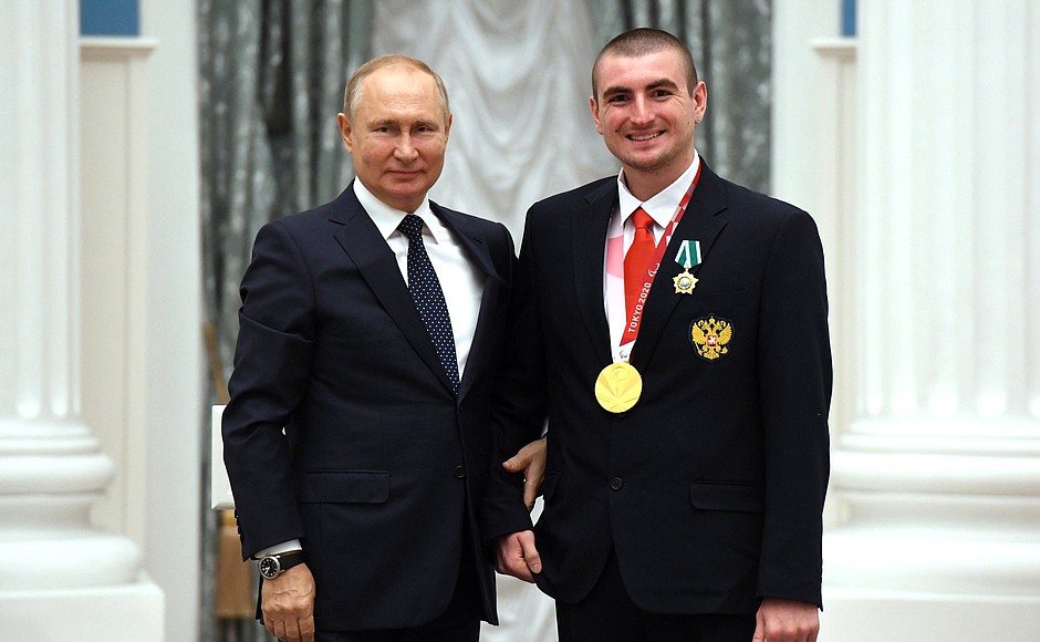 Presenting state decorations to winners of the 2020 Summer Paralympic Games in Tokyo. Andrei Gladkov, swimming champion of the Paralympics, receives the Order of Friendship.