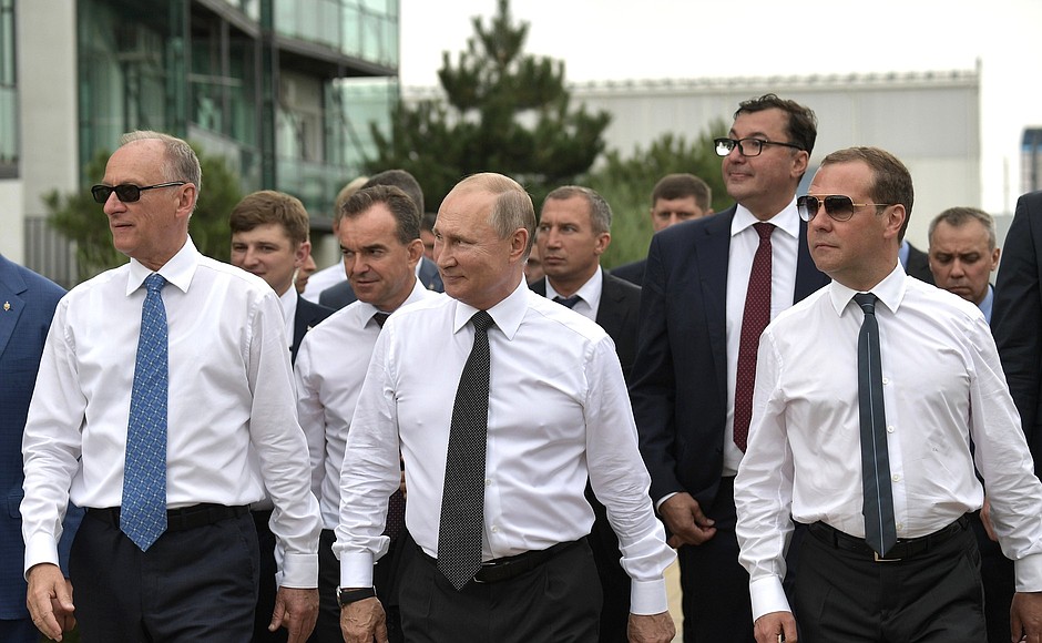 With Security Council Secretary Nikolai Patrushev (left) and Prime Minister Dmitry Medvedev during a visit to the VolleyGrad sports and fitness centre.