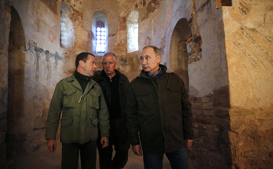 With Prime Minster Dmitry Medvedev (left) and Novgorod Region Governor Sergei Mitin during a tour of the St Nicholas Church on Lipno Island, a monument of Novgorod stone architecture.