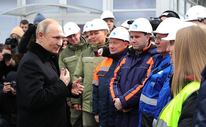 With the construction workers of the M11 Moscow-St Petersburg motorway.