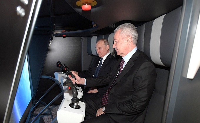 With Moscow Mayor Sergei Sobyanin during a visit to the Cosmos pavilion at the VDNKh exhibition.