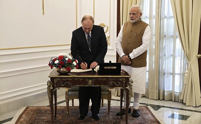 Vladimir Putin made an entry in the book of guests of honour at Hyderabad House.