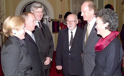 Adrienne Clarkson, the Governor General of Canada, and her husband with Vladimir and Lyudmila Putin at an official ceremony.