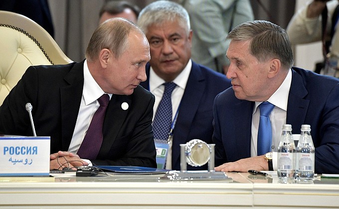 At the meeting of the heads of state participating in the Fifth Caspian Summit. With Presidential Aide Yury Ushakov (right) and Russian Interior Minister Vladimir Kolokoltsev.