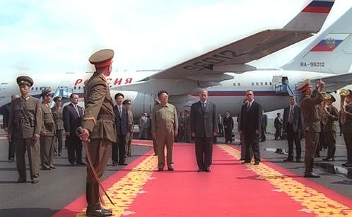 Vladimir Putin with North Korean leader Kim Jong-il during a welcoming ceremony at Sunan international airport.