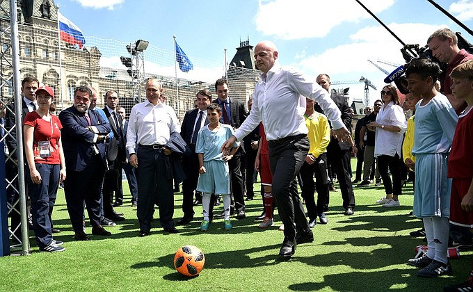 Vladimir Putin and Gianni Infantino looked around sports and entertainment sections of the 2018 FIFA World Cup Russia Football Park on Red Square.