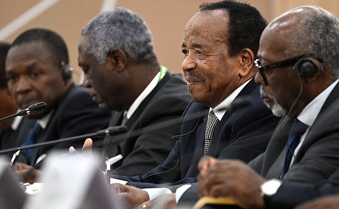 At a meeting with President of Cameroon Paul Biya (second right).