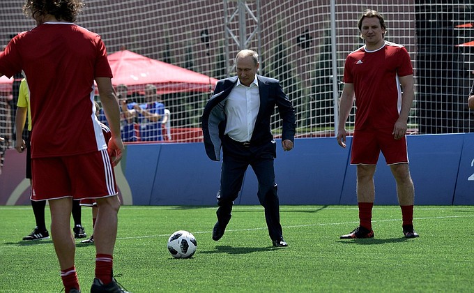 Vladimir Putin and Gianni Infantino start a friendly match between world football stars and young players from FC Totem Krasnoyarsk.