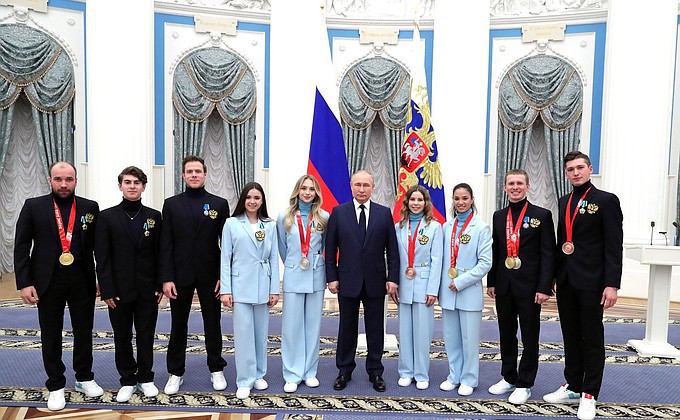 With gold medallists of the XXIV Olympic Winter Games.