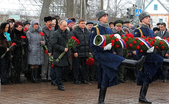 Laying flowers at a memorial to paratroopers, who died heroically in action during an operation in the North Caucasus in 2000.