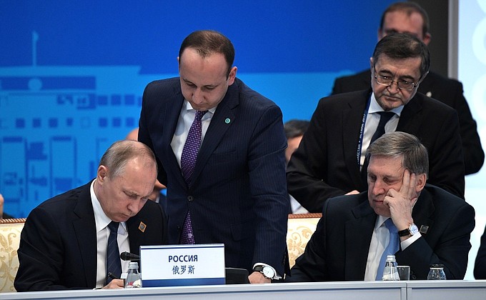 Signing documents following Shanghai Cooperation Organisation summit.