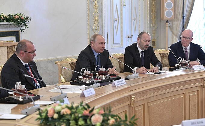From left: With TASS Director General Sergei Mikhailov, President and CEO of Deutsche Presse-Agentur Peter Kropsch, and Chief Executive of The Press Association Limited Clive Marshall at a meeting with heads of the world's leading news agencies.