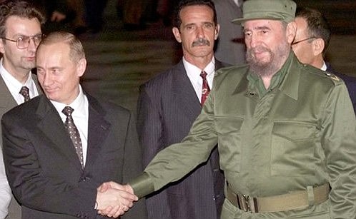 President Vladimir Putin with Cuban leader Fidel Castro during a welcoming ceremony at the airport.