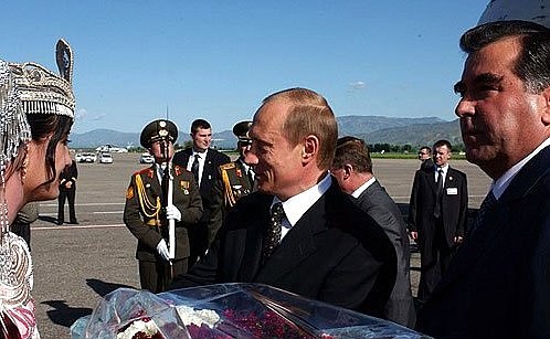 President Putin meeting with Tajik President Emomali Rakhmonov, right, at the airport upon arriving in Tajikistan.