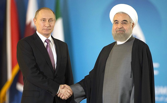 With President of Iran Hassan Rouhani before the start of the Gas Exporting Countries Forum summit.
