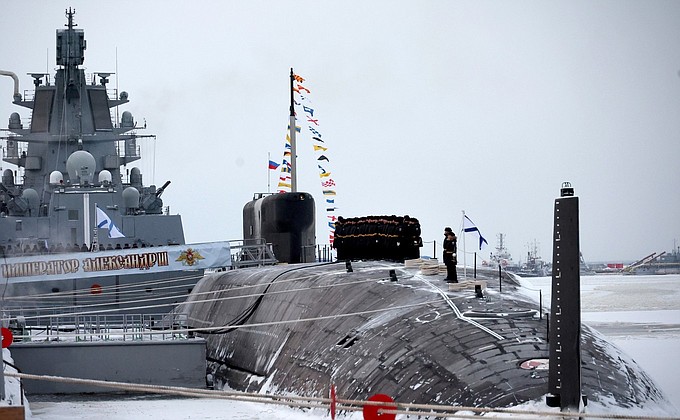 Ceremony for raising naval flag on nuclear-powered submarine Emperor Alexander III .