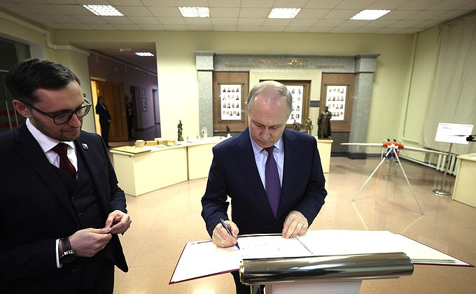 Vladimir Putin signed the Honoured Guests book of the Pacific National University.