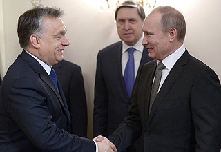 With Prime Minister of Hungary Viktor Orban. Presidential Aide Yury Ushakov in the background.