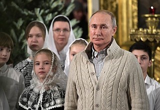 On Christmas Eve Vladimir Putin attended a service at the Transfiguration Cathedral in St Petersburg.