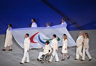 XI Paralympic Winter Games opening ceremony. Carrying the Russian national flag.