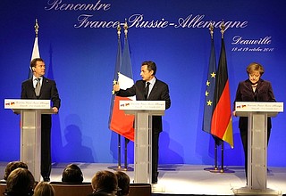 At joint news conference following Russian-French-German talks. With President of France Nicolas Sarkozy and Federal Chancellor of Germany Angela Merkel.