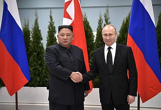 С Председателем Государственного совета КНДР Ким Чен Ыном.