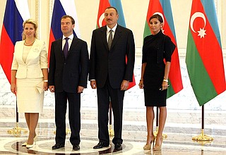 Dmitry Medvedev with his wife Svetlana and Ilham Aliyev with his wife Mehriban.