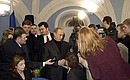President Putin talking to journalists at his campaign headquarters.
