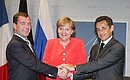 С Федеральным канцлером Германии Ангелой Меркель и Президентом Франции Николя Саркози.