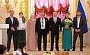 Presenting the Order of Parental Glory to Marem and Alekhan Izmailov, who are raising 7 children.