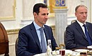 Президент Сирии Башар Асад и секретарь Совета Безопасности России Николай Патрушев во время российско-сирийских переговоров.