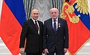 Presentation of state decorations in the Kremlin. Mikhail Fradkov, Director of Russian Institute of Strategic Studies, receives the Order of Courage.