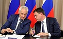 Presidential Aide Andrei Belousov (left) and Minister of Energy Alexander Novak at a meeting on electric power industry development.
