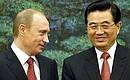 With the President of the People\'s Republic of China Hu Jintao while signing Russian-Chinese documents. Photo: Sergey Guneev, RIA Novosti