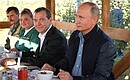 With Prime Minister Dmitry Medvedev at the meeting with employees of the Rassvet agricultural company.