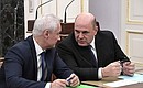 Prime Minister Mikhail Mishustin, right, and First Deputy Prime Minister Andrei Belousov at a meeting with Government members.